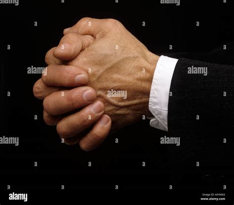 close up of clenched hands wringing together Stock Photo - Alamy