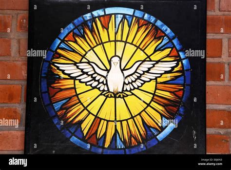 Stained glass in church : the dove symbolises the holy spirit Stock Photo - Alamy