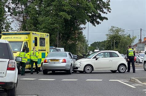 Two-vehicle crash on roundabout partially blocks main road in Swindon