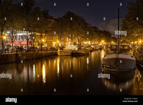 Amsterdam canal at night Stock Photo - Alamy