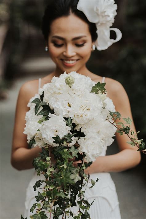 This beautiful white & green wedding bouquet is so beautiful and has a gorgeousness comparable ...