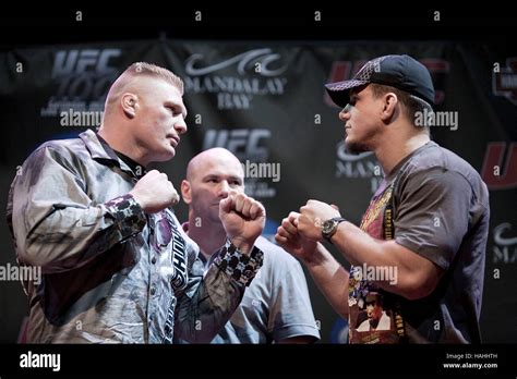 Brock Lesnar, left, and Frank Mir at the UFC 100 press conference at ...