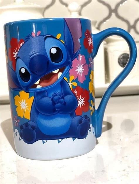 a blue and white coffee mug with an image of stitcher from the disney movie