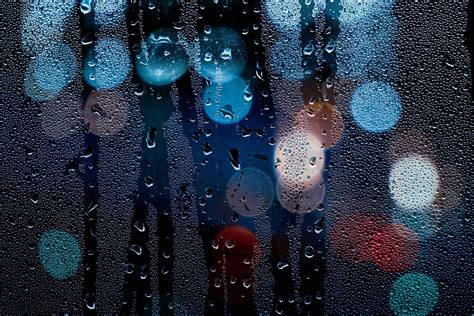 raindrops on the window and street lights at night 7484162 Stock Photo ...