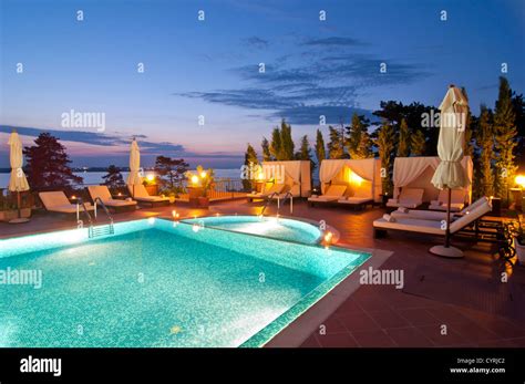 Swimming pool of luxury hotel at night Stock Photo - Alamy