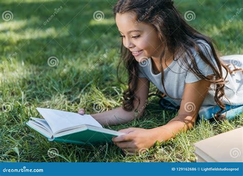 Cute Smiling Child Lying on Grass Stock Photo - Image of copyspace, happy: 129162686