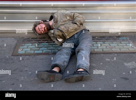 Homeless man sleeping on the street in central London England UK Stock ...