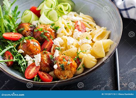 Conchiglie with Meatballs, Feta Cheese and Salad on Dark Background. Stock Photo - Image of ...