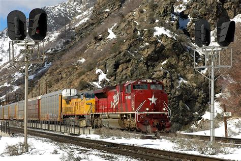 UP 1988, "The Katy" leads an eastbound autorack through Devils Gate on ...