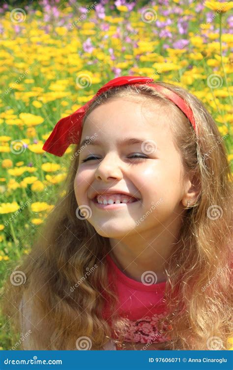 Happy Girl Smiling in a Yellow Flowers Garden Stock Image - Image of ...