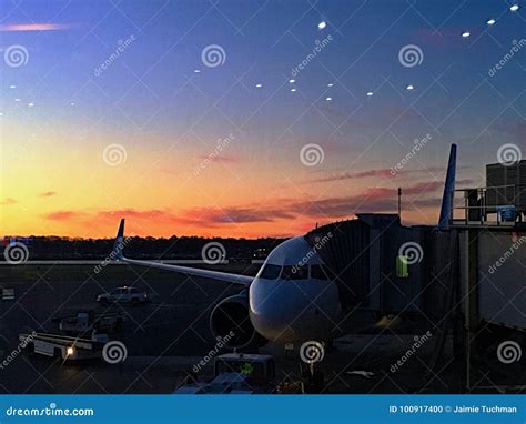 Sunset at the airport stock photo. Image of businessman - 100917400