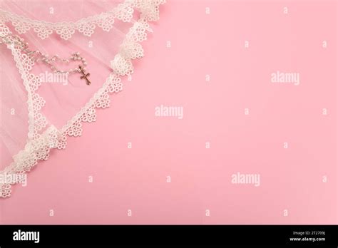 Christening background with baptism baby dress and cross on pink background Stock Photo - Alamy