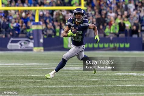 Tyler Lockett of the Seattle Seahawks catches a pass and runs against ...