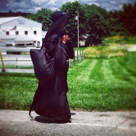 Who Is This Mysterious Woman In Black Travelling Across The United States?