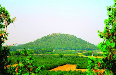 The huge burial mound of Maoling, the tomb of emperor Wu of Han, looks ...