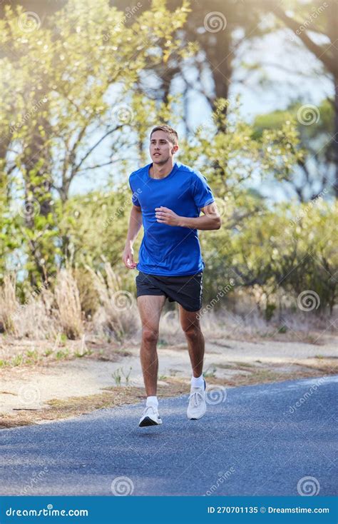 Athlete, Running and Man Exercise in a Road Outdoors for Health, Wellness and Fitness for Energy ...