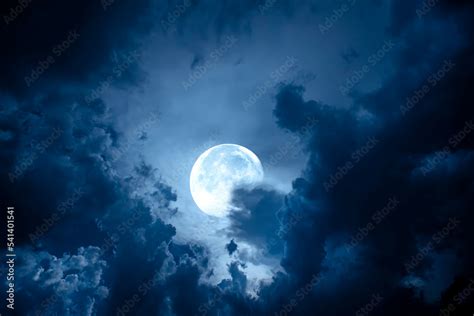 Night sky with full moon. Dramatic clouds in mystic moonlight. Large ...