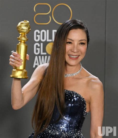 Photo: Michelle Yeoh Wins Best Actress in a Motion Picture - Musical Award at the Golden Globes ...