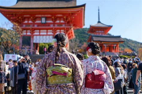 Young girl wearing Japanese kimono standing in Kyoto, Japan. Kimono is ...