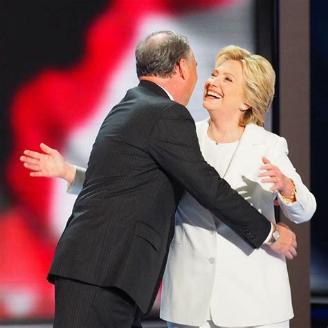 Hillary Clinton embraces her running mate, Virginia Senator Tim Kaine, following the conclusion ...