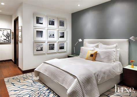 White Master Bedroom With Gray Accent Wall - Luxe Interiors + Design