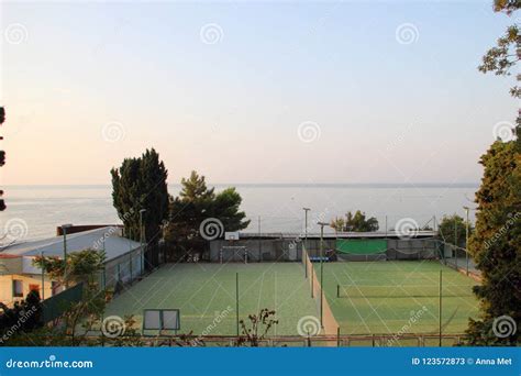 Tennis Courts by the Sea with Green Carpet Stock Image - Image of lines ...