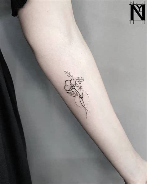 Minimalist floral bundle tattoo by Noam Yona - Tattoogrid.net