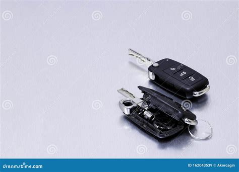 Broken or Damaged Car Key Fob and New Remote Vehicle Key on Aluminium Background. Repair of ...