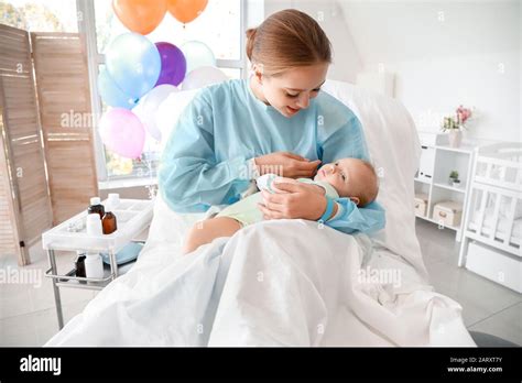 Young mother with newborn baby in maternity hospital Stock Photo - Alamy