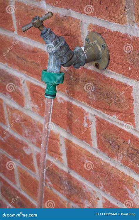 Outside Tap, Water Running with Hose Connector Fitted Stock Photo ...