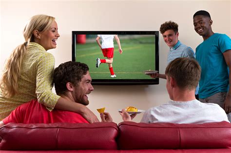 Group Of Friends Watching Sports On Tv Stock Photo - Download Image Now - iStock