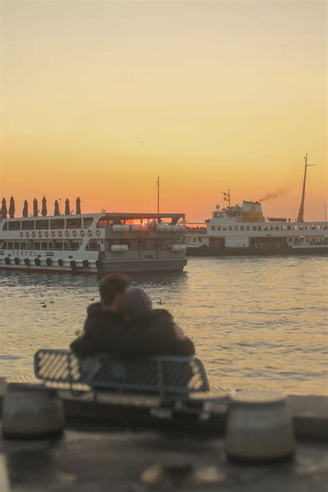 Couple Sitting on a Bench and Watching the Sunset · Free Stock Photo