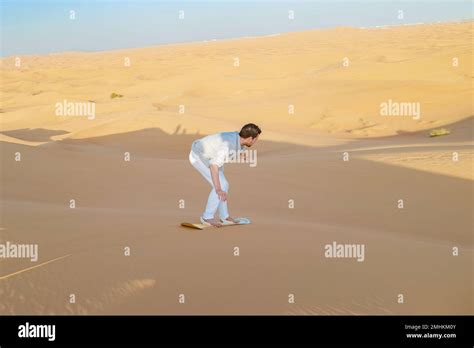 Dubai desert safari sandboard hi-res stock photography and images - Alamy