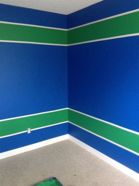Painted Jesse's room Vancouver Canucks colours... Blue and Green ...