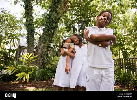 Happy African-American children playing in back yard Stock Photo - Alamy