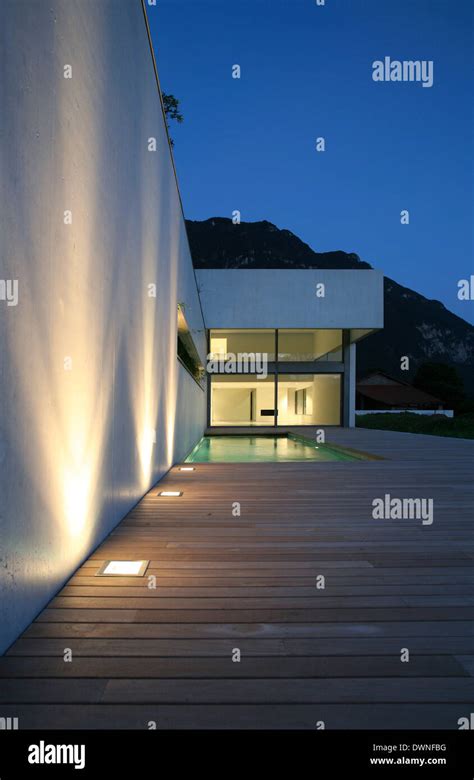 modern house with pool in the night, exterior Stock Photo - Alamy