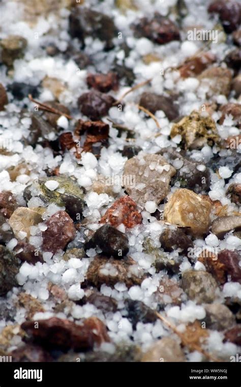 Photography of hailstones on a pebble subsoil Stock Photo - Alamy