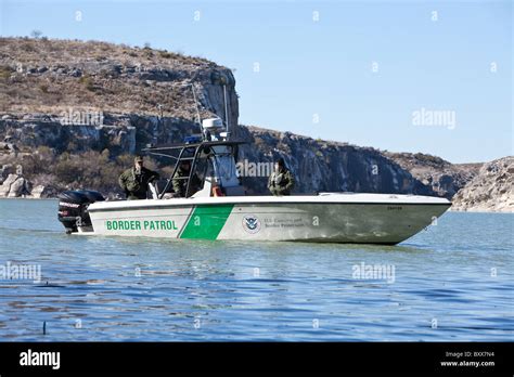 U.S. Border Patrol agents on the Rio Grande River arm of Lake Amistad in West Texas, which forms ...