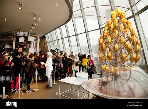 Chocolate Museum, Cologne - Lindt staff giving out chocolate to Stock Photo: 64914633 - Alamy