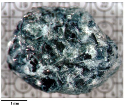 Figure F36. Image of a single piece of blue (sodic) amphibole schist containing white mica and ...