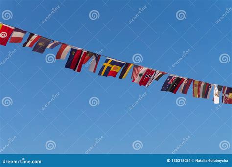 Row of Small Flags of Different Countries on a Rope Stock Photo - Image of symbol, blue: 135318054