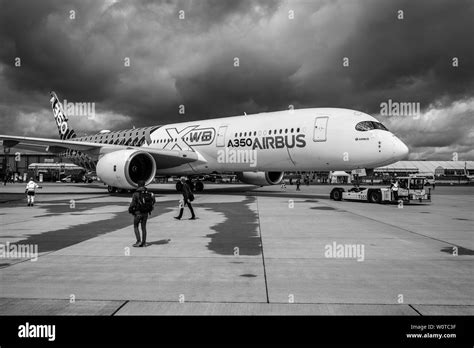 BERLIN, GERMANY - APRIL 26, 2018: Wide-body jet airliner Airbus A350 XWB on the airfield. Black ...