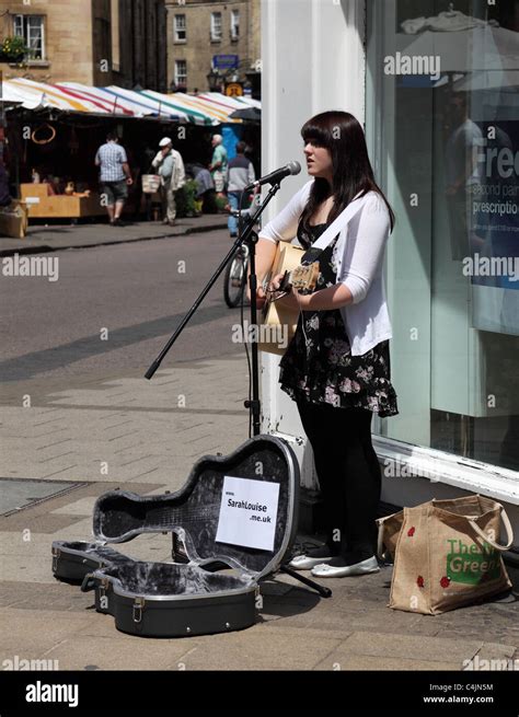 Busker on street corner Cambridge England Stock Photo - Alamy