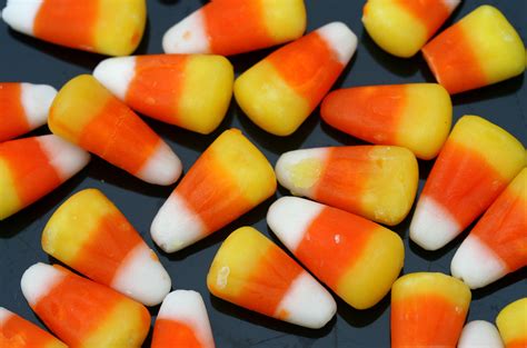 File:Candy corn strewn on a black background.jpg - Wikimedia Commons