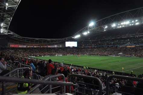 a stadium filled with lots of people watching a soccer game on the ...