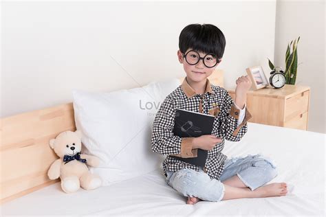 A Little Boy Reading In Bed Picture And HD Photos | Free Download On Lovepik