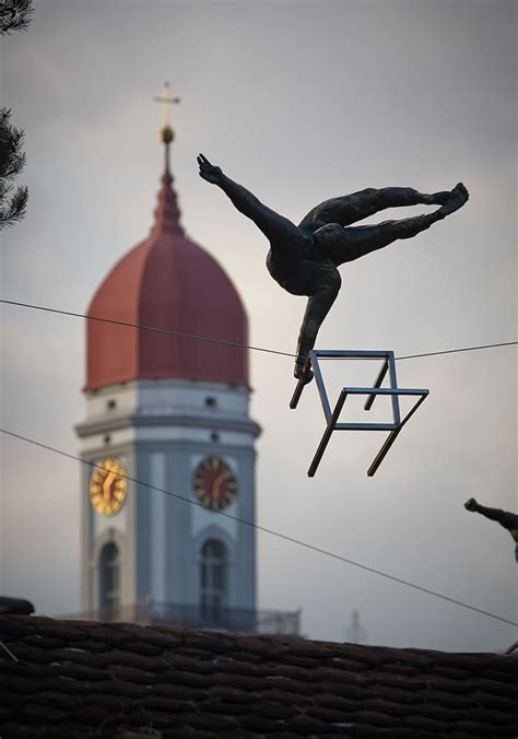 Artist Installs Gravity-Defying Sculpture in Public Spaces Around the World