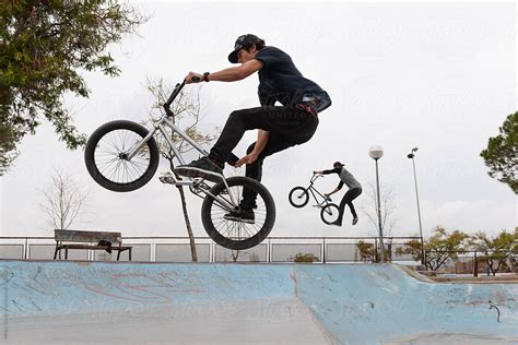 Riders performing BMX tricks by Milles Studio - Trick, Stunt - Stocksy ...