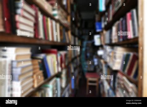 Many books on bookshelf in library Stock Photo - Alamy