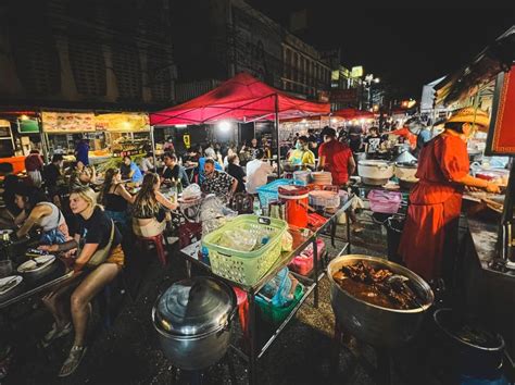 Night Street Food Market in Bangkok, Thailand Bustling with Shoppers ...